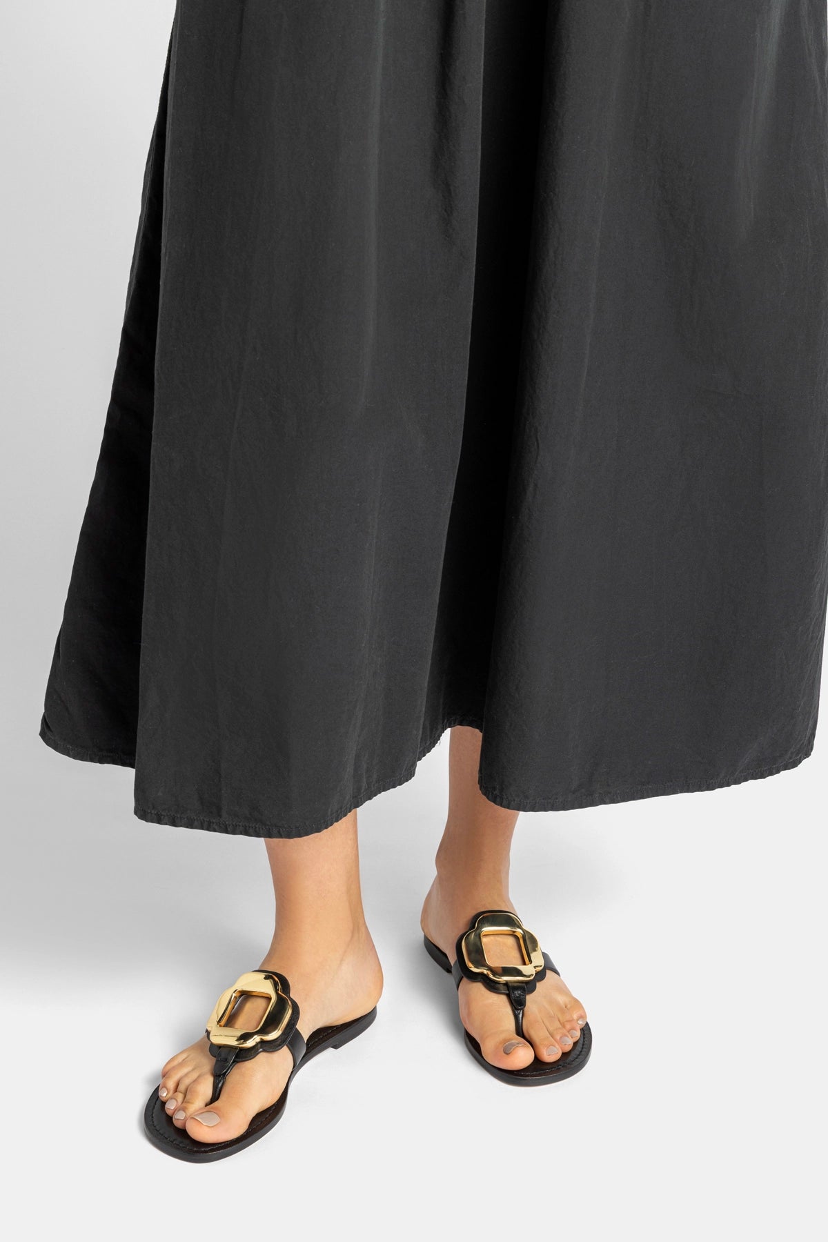 Margherita Thong Sandal in Black Leather and Gold Hardware